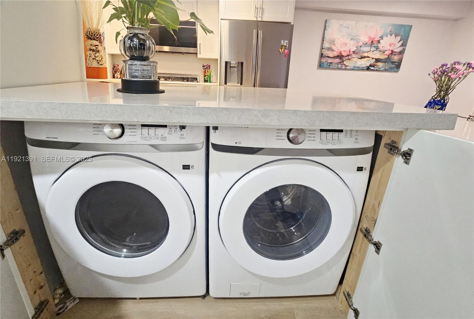 10700 Northwest 7th Street, Unit 5A Miami, FL 33172 - Photo 10 of 20 a utility room with dryer and washer