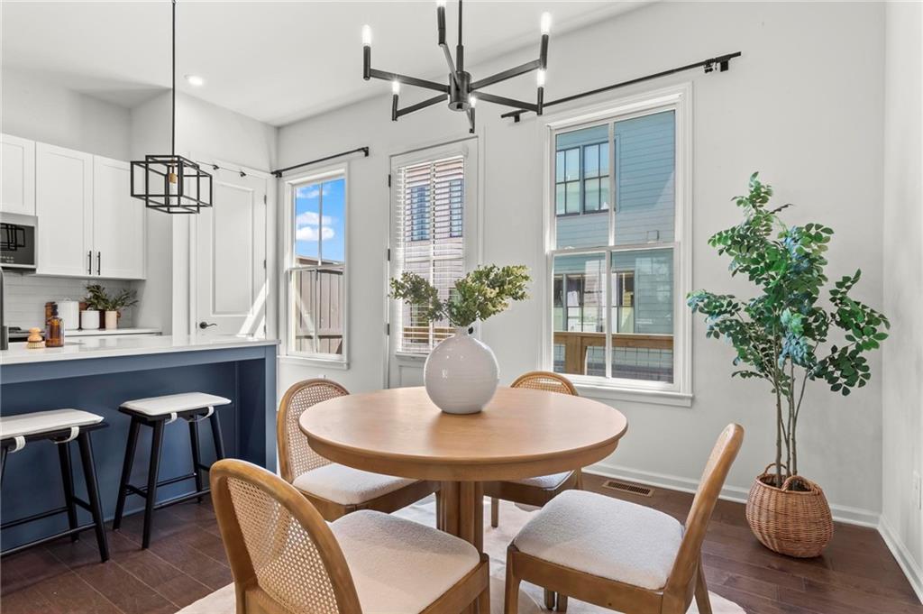 718 Needletail Way Atlanta, GA 30312 - Photo 6 of 44 a view of a dining room with furniture window and wooden floor