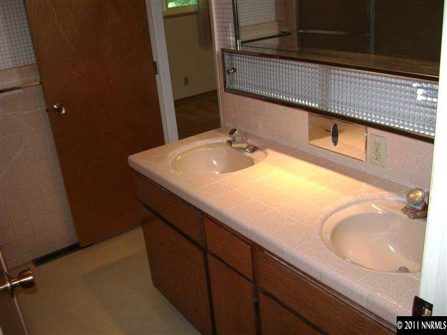2075 Regent Street Reno, NV 89509 - Photo 8 of 13 a bathroom with a sink and a mirror