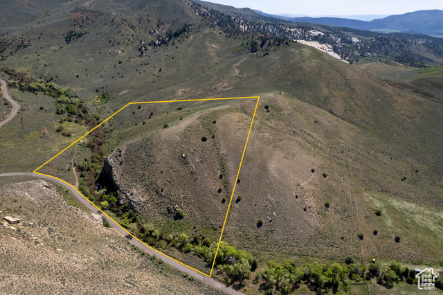 Overview of rural landscape featuring mountains and property boundaries highlighted