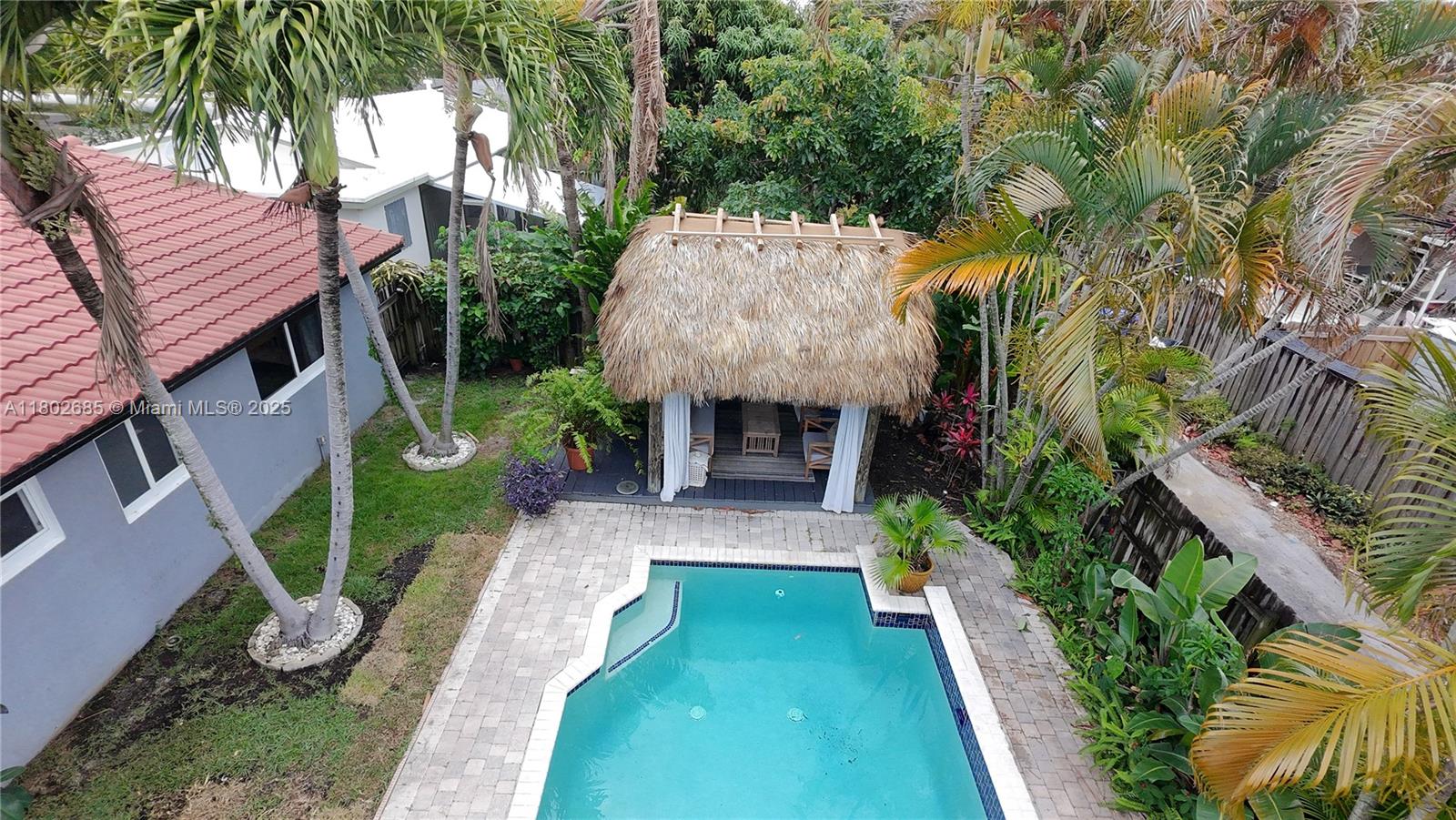 3192 Coolidge Street Hollywood, FL 33021 - Photo 16 of 34 a view of an house with backyard space and garden