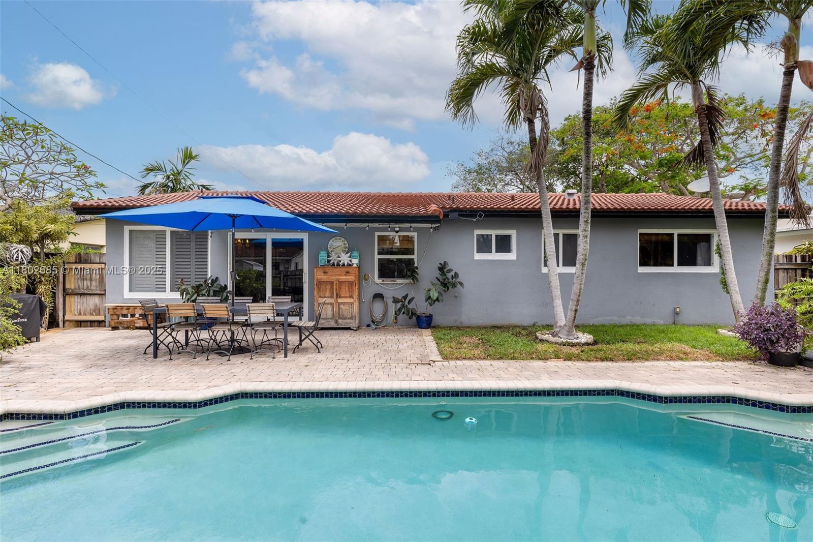 3192 Coolidge Street Hollywood, FL 33021 - Photo 20 of 34 a view of a house with pool and chairs