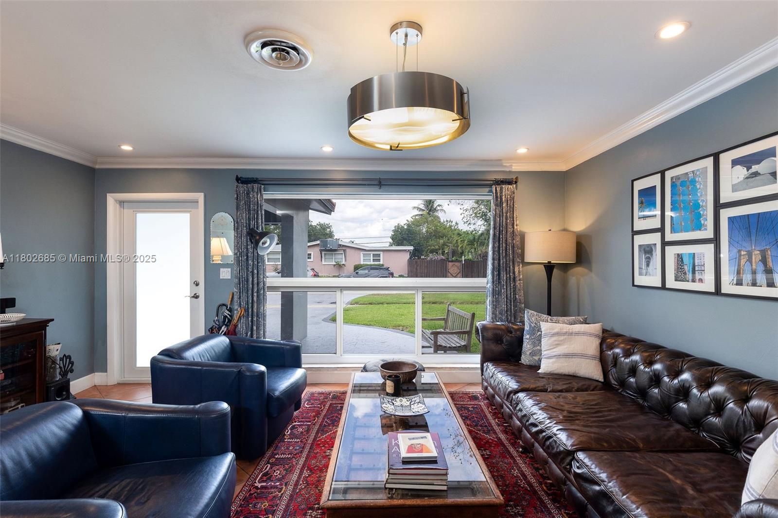 3192 Coolidge Street Hollywood, FL 33021 - Photo 2 of 34 a living room with furniture and a large window