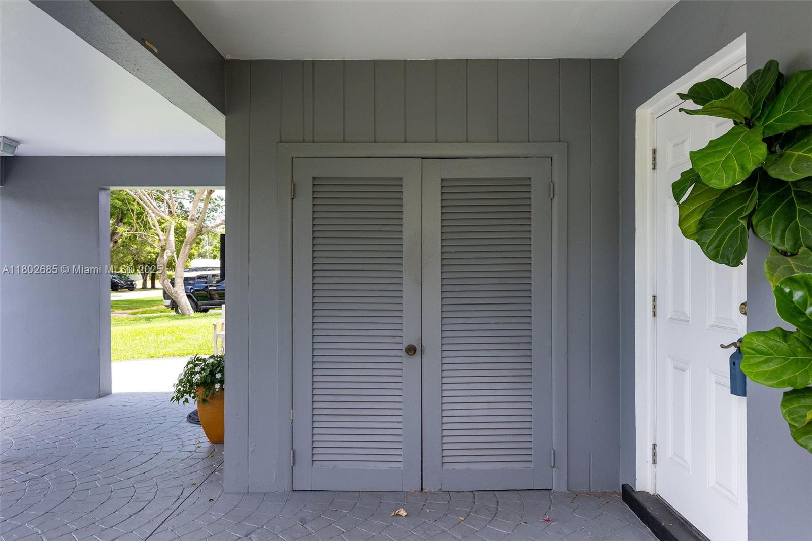 3192 Coolidge Street Hollywood, FL 33021 - Photo 24 of 34 a view of a hallway with wooden floor and a potted plant