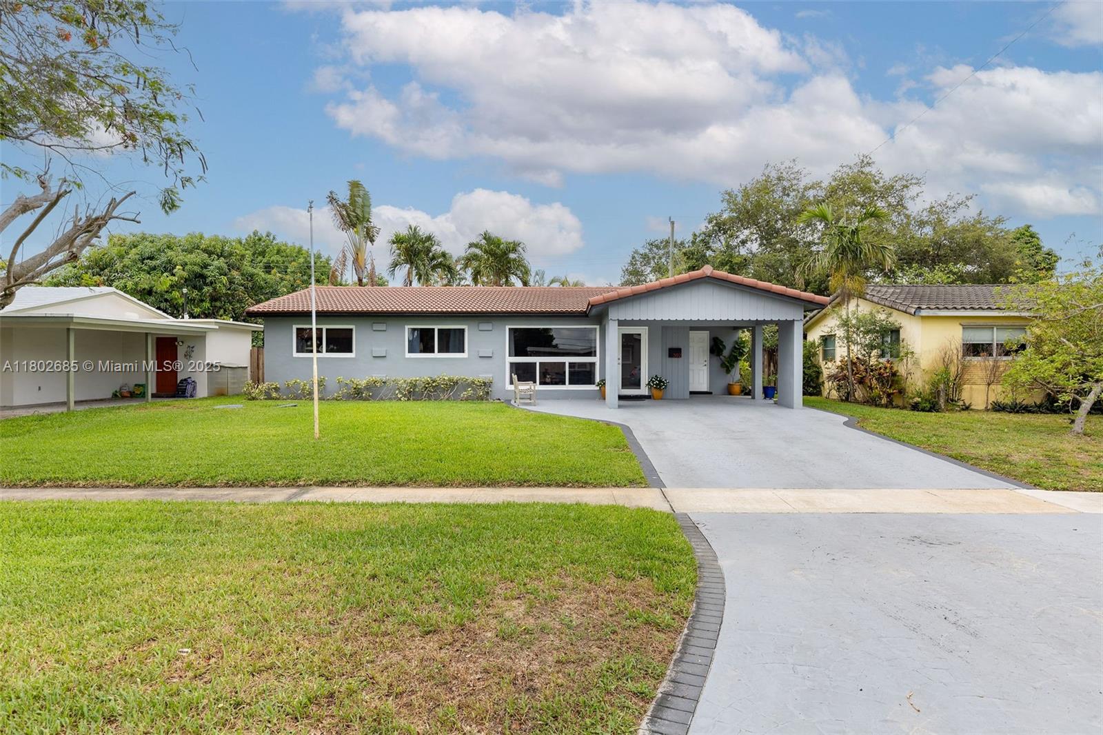 3192 Coolidge Street Hollywood, FL 33021 - Photo 30 of 34 a view of house that has a yard