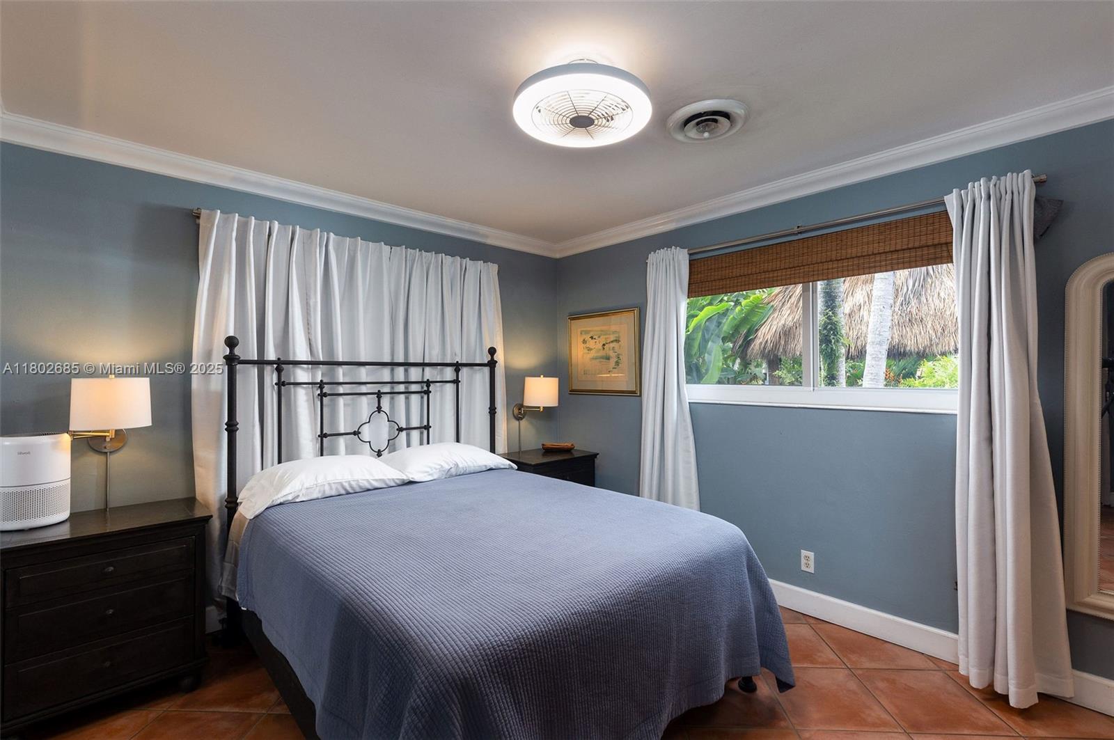 3192 Coolidge Street Hollywood, FL 33021 - Photo 6 of 34 a bedroom with a large bed and a large window