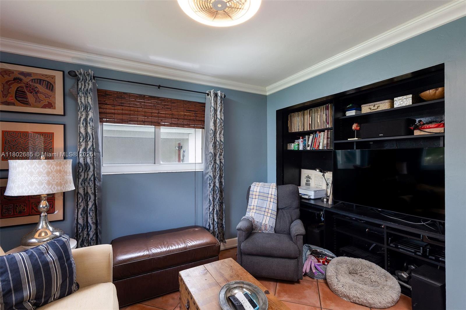 3192 Coolidge Street Hollywood, FL 33021 - Photo 9 of 34 a living room with furniture and a flat screen tv