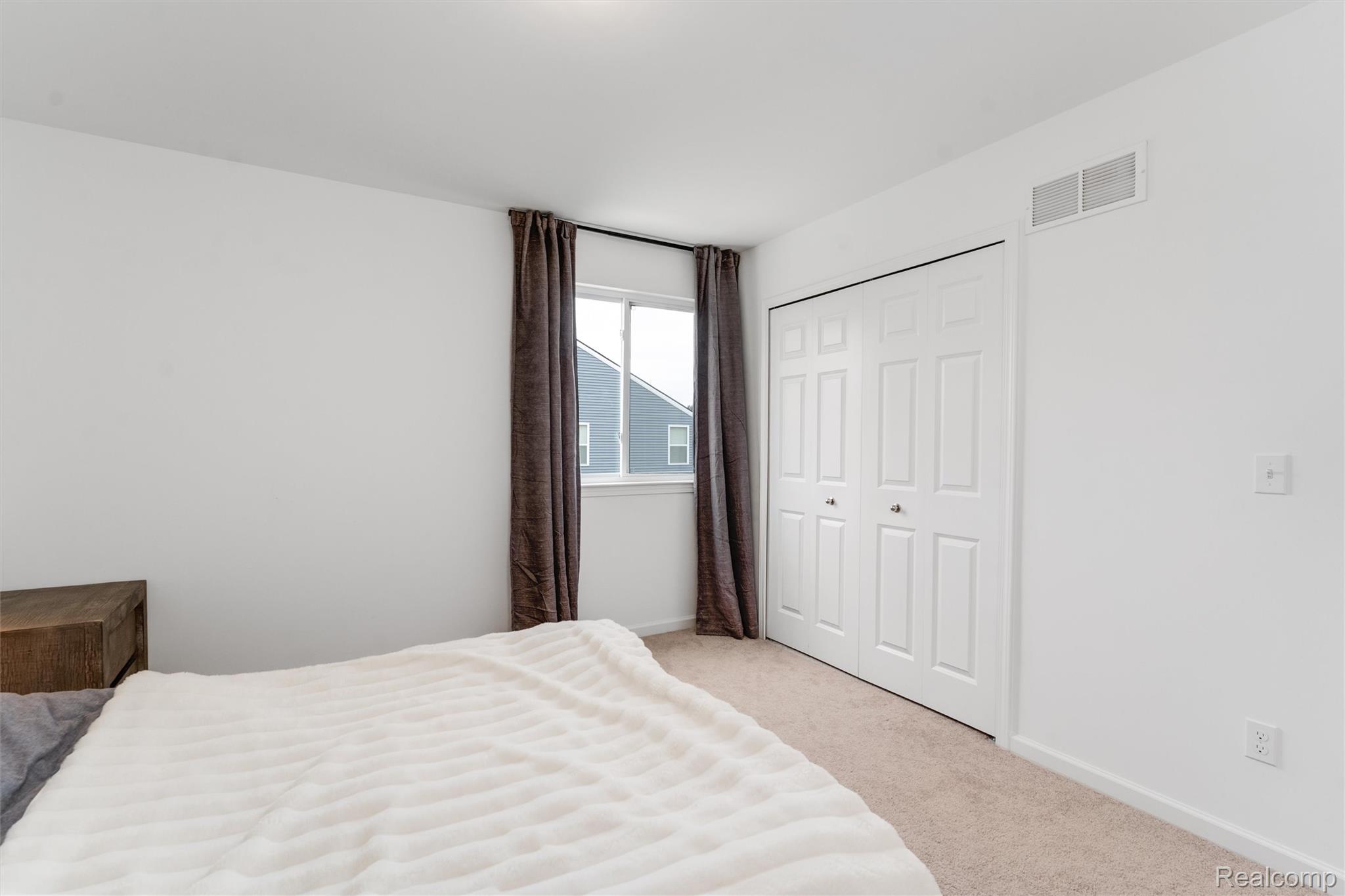 908 South Livernois Road Rochester, MI 48309 - Photo 32 of 49 Bedroom featuring light colored carpet and a closet