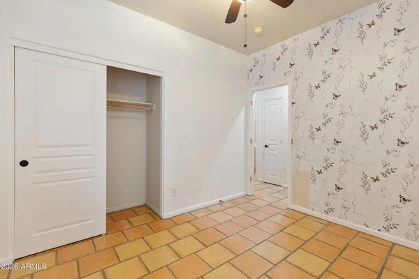 a view of an empty room with a window