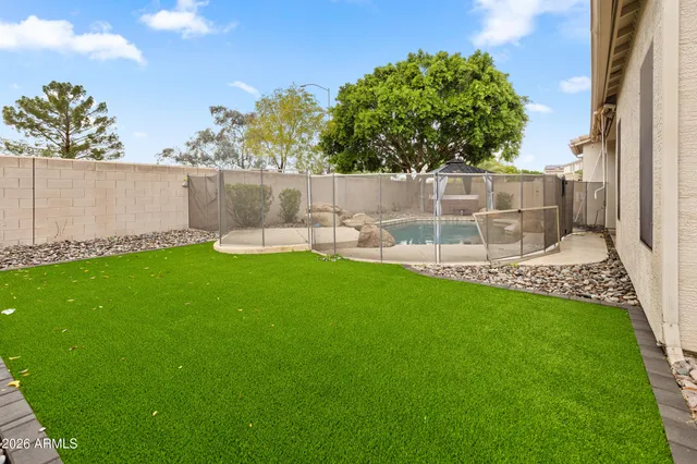 a view of a backyard of the house