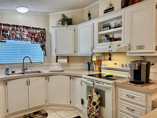 a kitchen with appliances cabinets and a sink