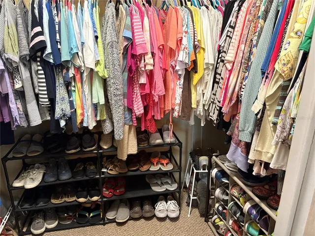 a room with lots of different colored cloths