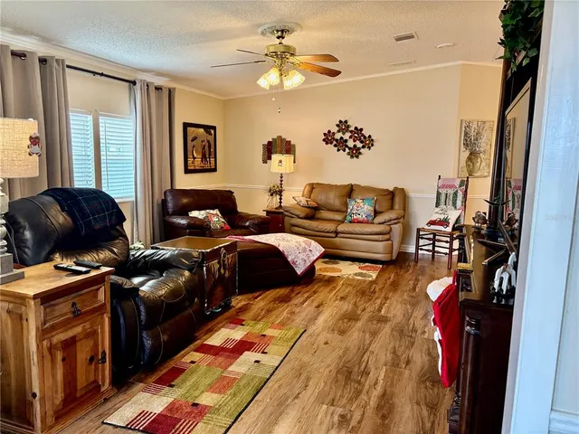 a bedroom with furniture and a chandelier