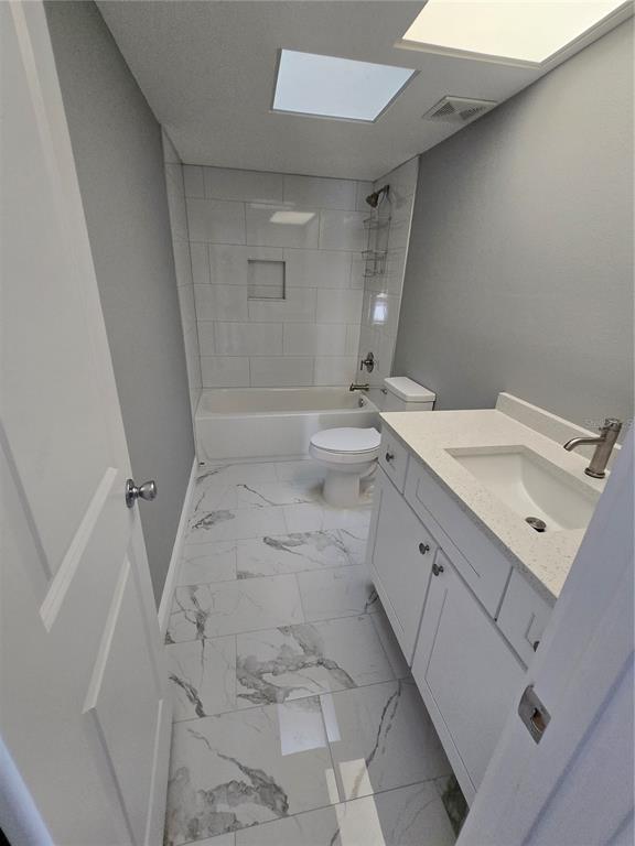 4836 Onyx Lane, Unit B New Port Richey, FL 34652 - Photo 9 of 13 a bathroom with a sink and mirror
