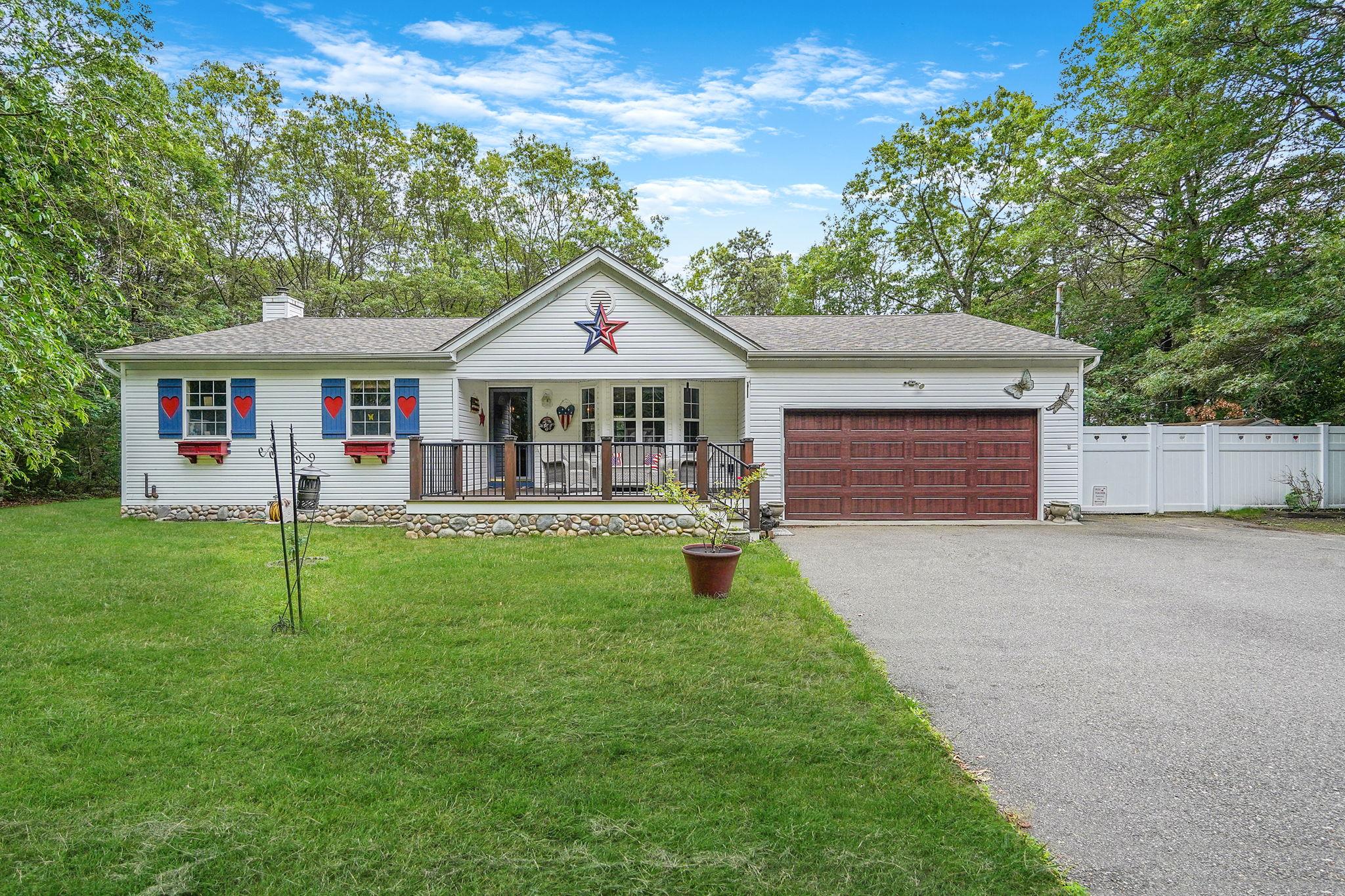 138 Barton Avenue Patchogue, NY 11772 - Photo 1 of 1 front view of a house with a yard