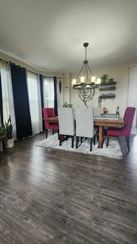 a kitchen with a sink a stove and cabinets
