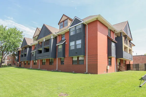 a view of a building with a yard