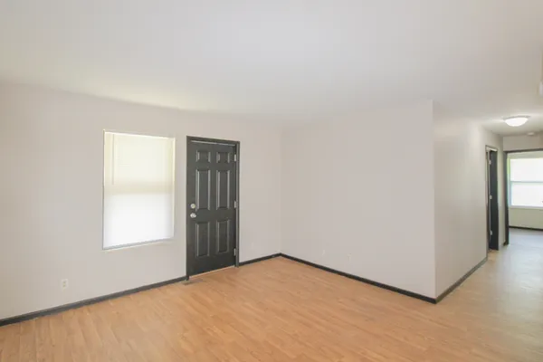 a view of an empty room with a window