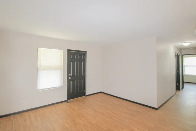 a view of an empty room with a window