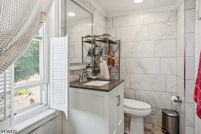 33 Pulaski Place Hackensack, NJ 07601 - Photo 23 of 31 a bathroom with a sink a toilet and shower