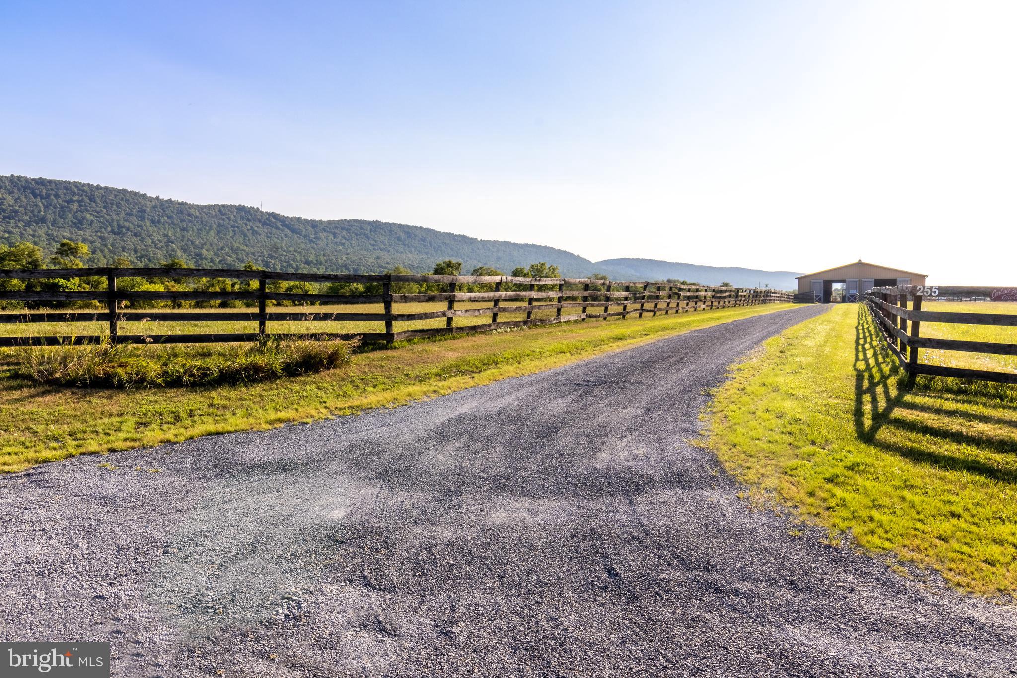 255 Sheaffer Road Carlisle, PA 17013 - Photo 4 of 25 a view of a lake with a mountain in the background