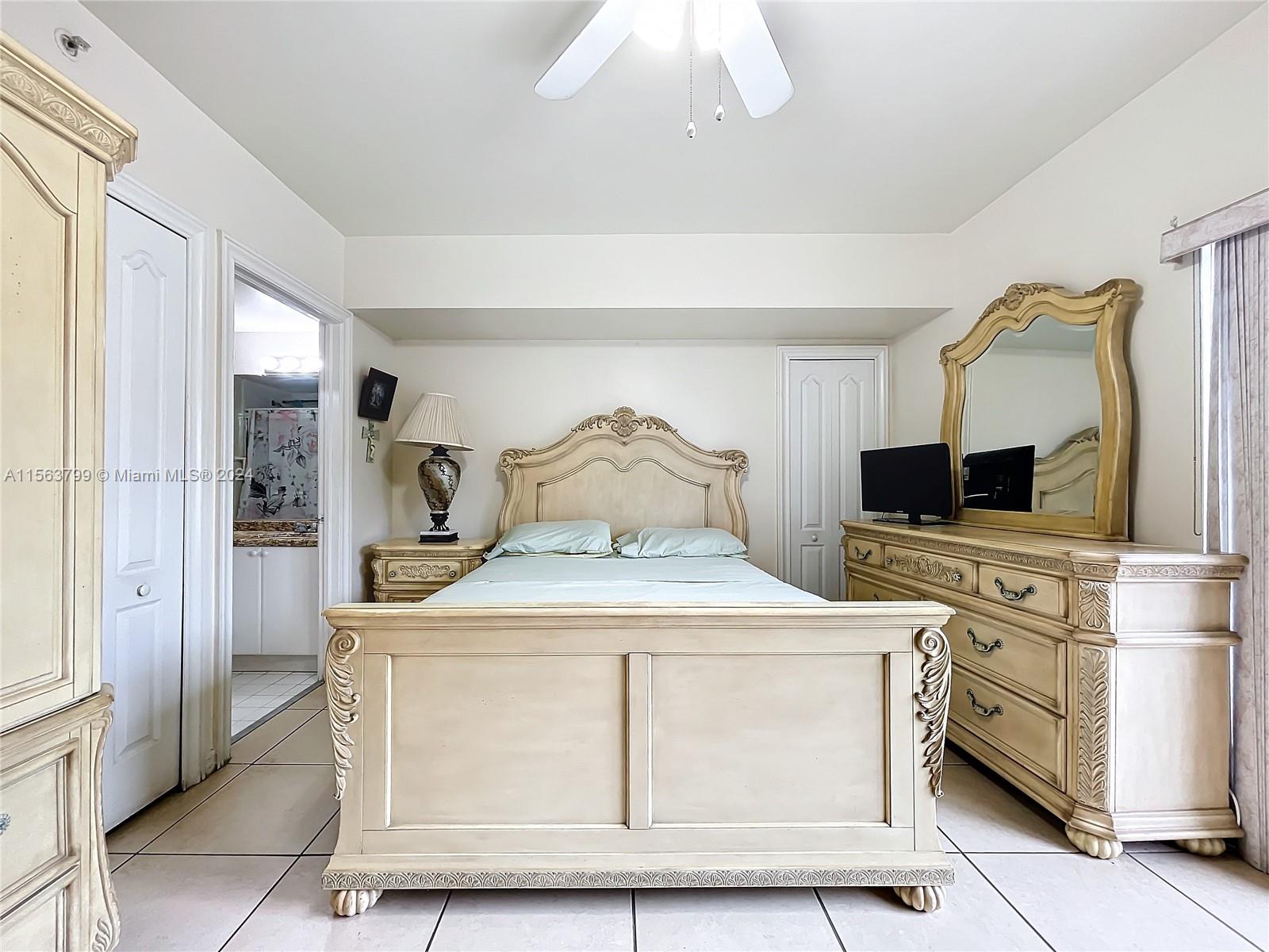 120 South Douglas Road, Unit 302 Miami, FL 33134 - Photo 13 of 28 a room with kitchen island stainless steel appliances a stove refrigerator and microwave