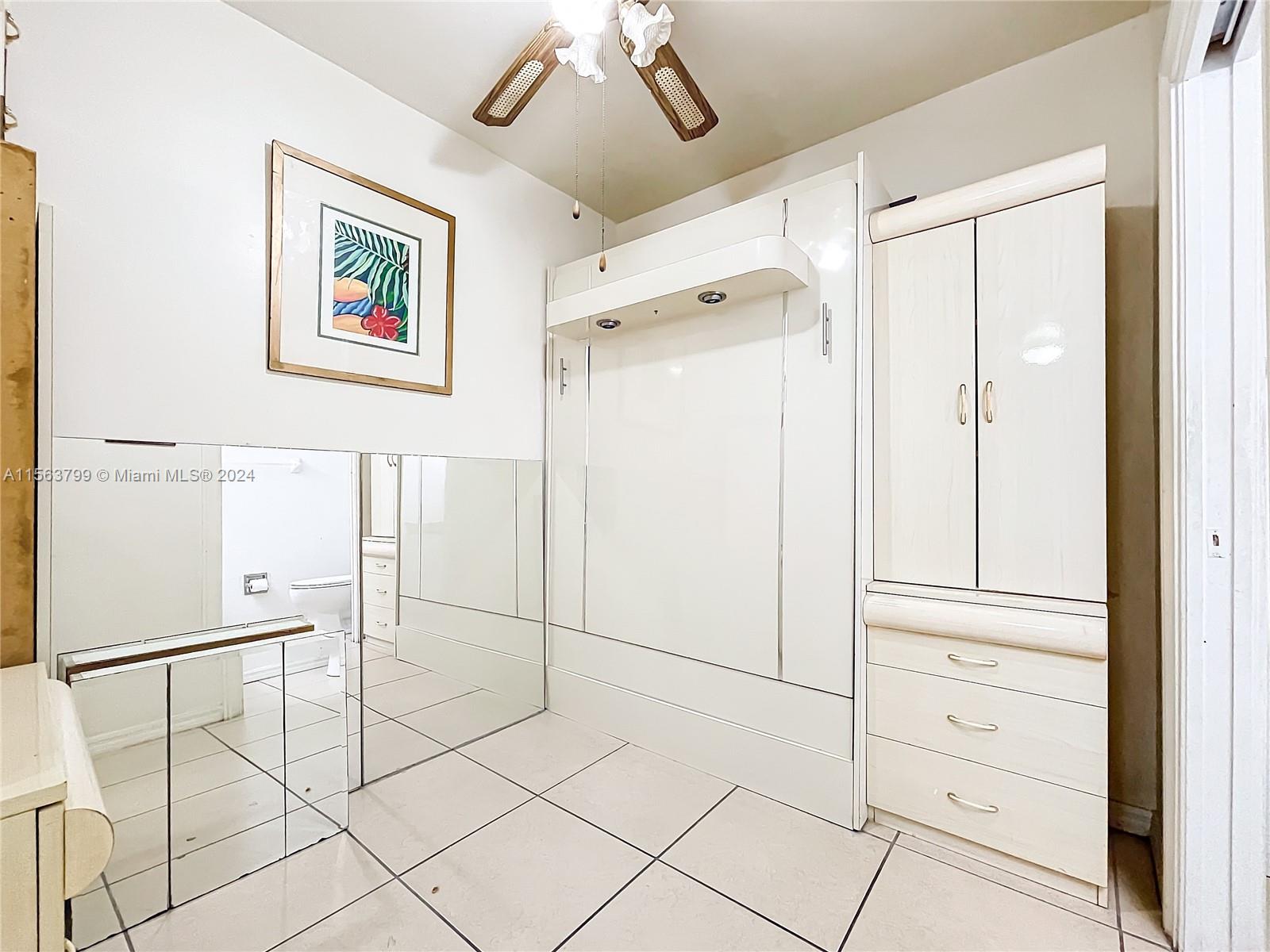 120 South Douglas Road, Unit 302 Miami, FL 33134 - Photo 16 of 28 a view of cabinets and wooden floor