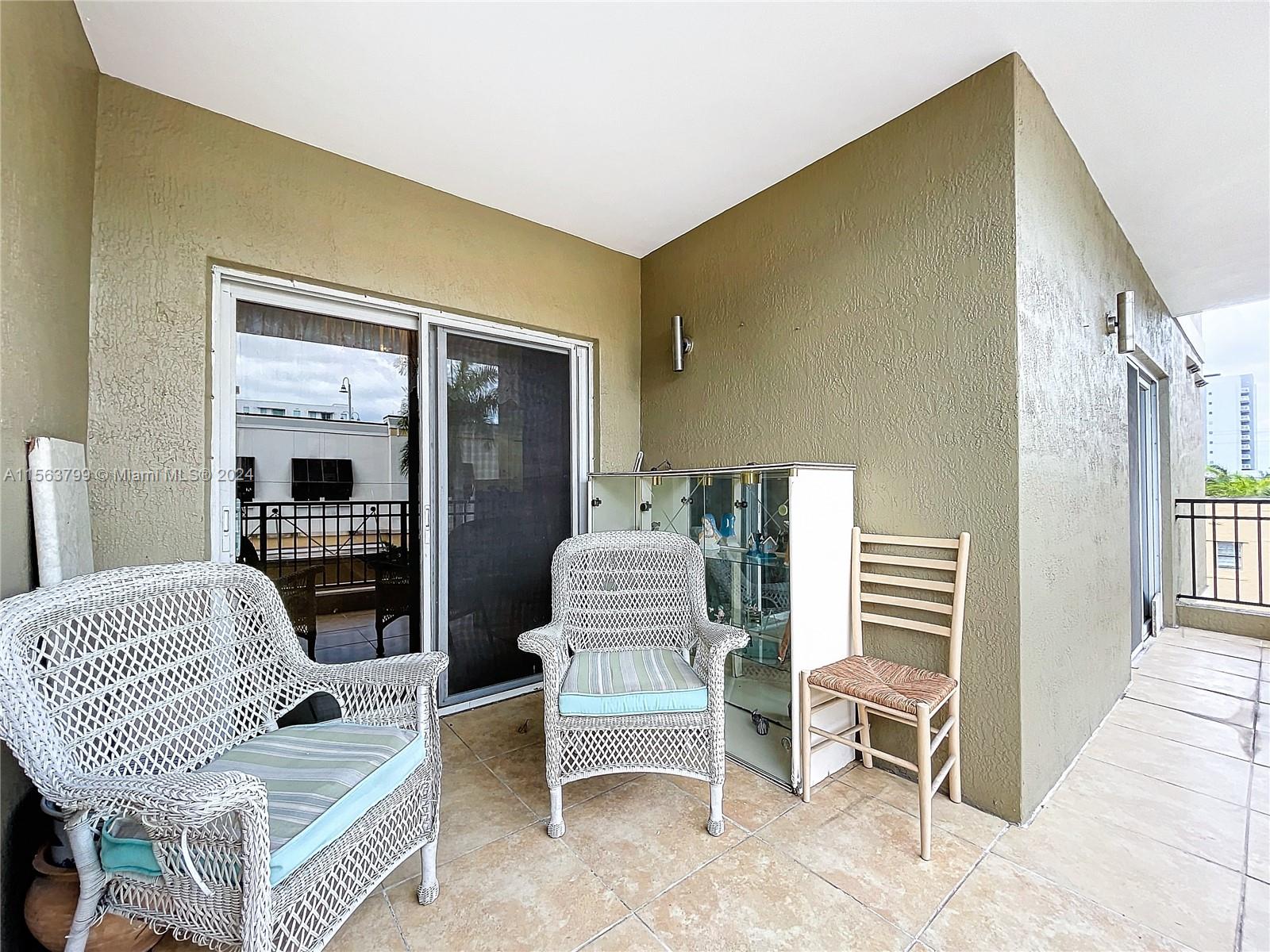 120 South Douglas Road, Unit 302 Miami, FL 33134 - Photo 20 of 28 a bedroom with furniture and a window