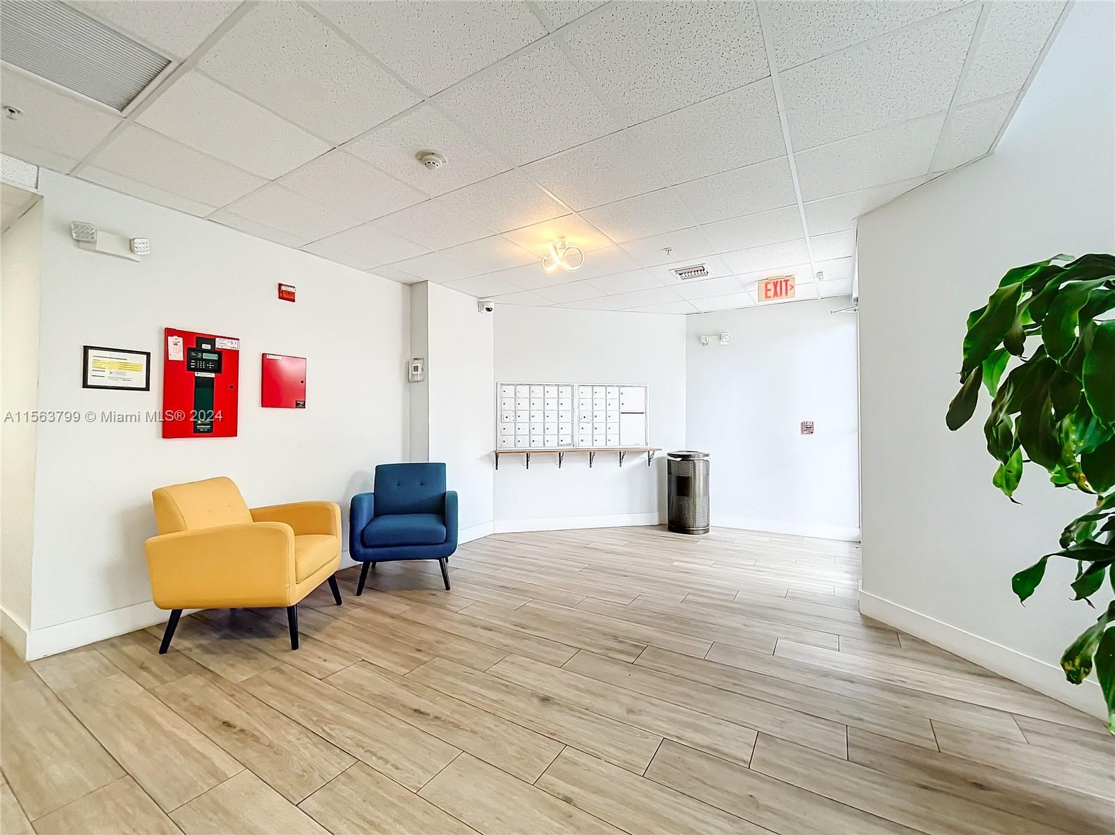 120 South Douglas Road, Unit 302 Miami, FL 33134 - Photo 5 of 28 a living room with furniture and a potted plant