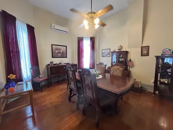a view of a dining room with furniture and chandelier