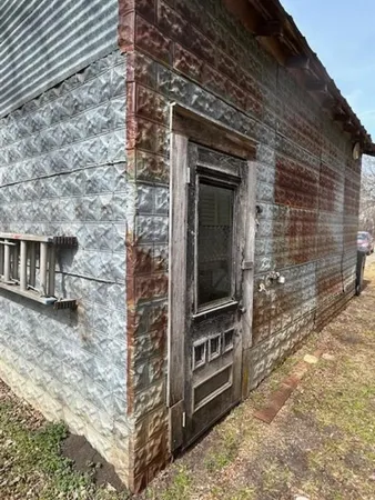 a front view of a house with parking space