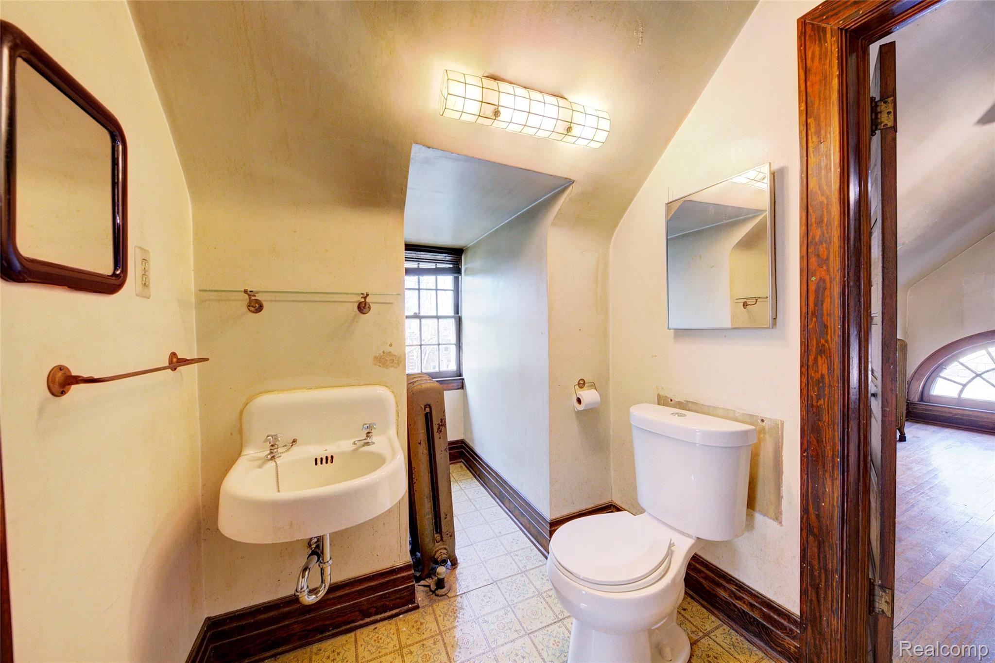 121 Longfellow Street Detroit, MI 48202 - Photo 63 of 87 Half bathroom with vaulted ceiling and radiator