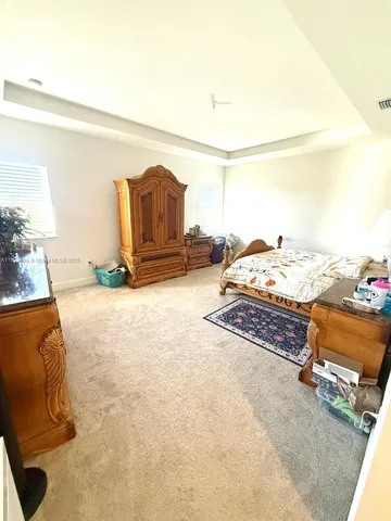 a bed room with a bed and a couch