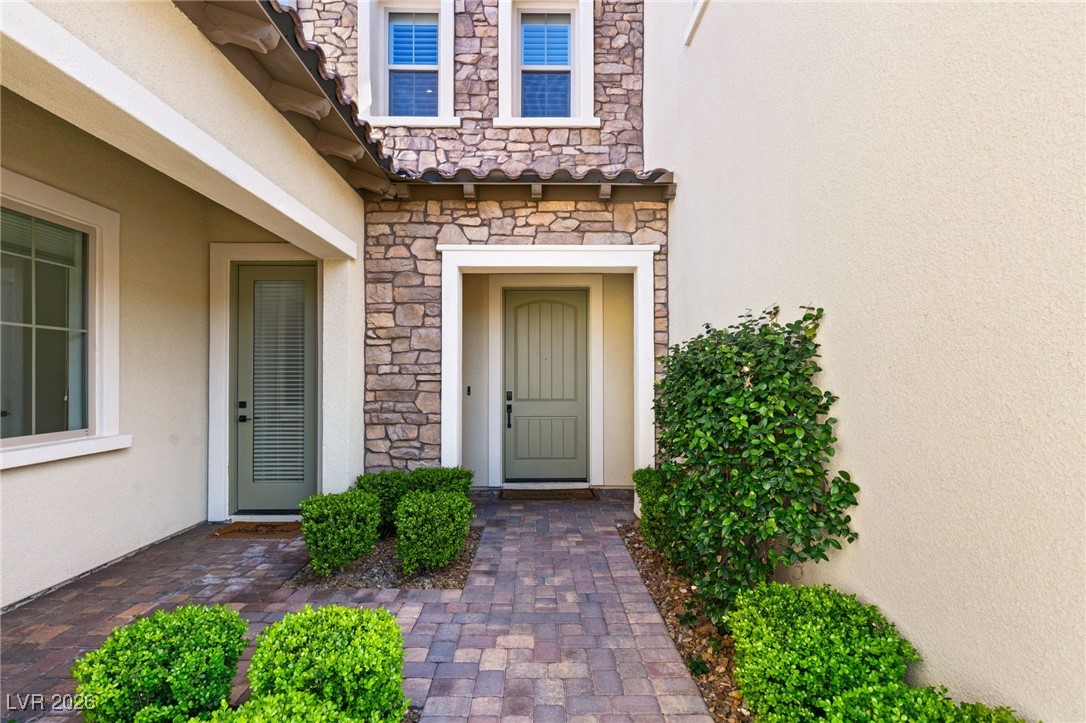 4039 Villa Rafael Drive Las Vegas, NV 89141 - Photo 13 of 45 Entrance to property featuring stone siding and stucco siding