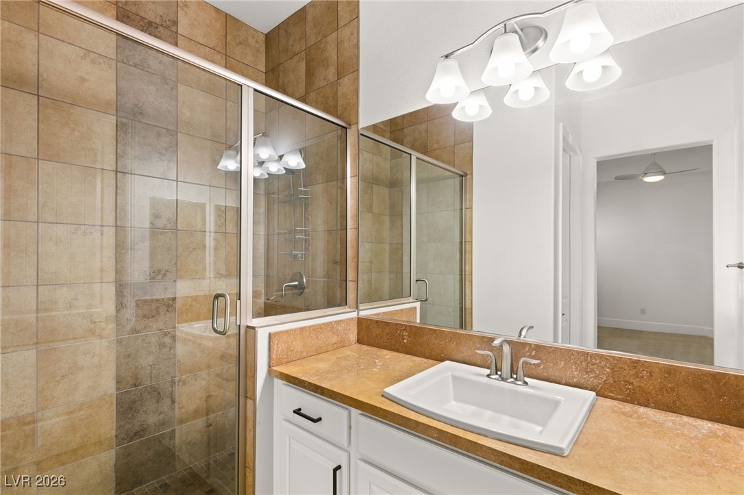 4039 Villa Rafael Drive Las Vegas, NV 89141 - Photo 31 of 45 Full bath with a stall shower, vanity, and a chandelier