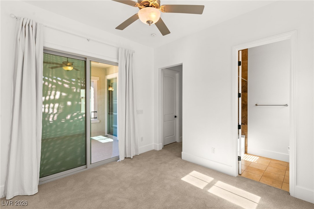 4039 Villa Rafael Drive Las Vegas, NV 89141 - Photo 36 of 45 Unfurnished bedroom featuring light colored carpet, access to outside, ceiling fan, and connected bathroom