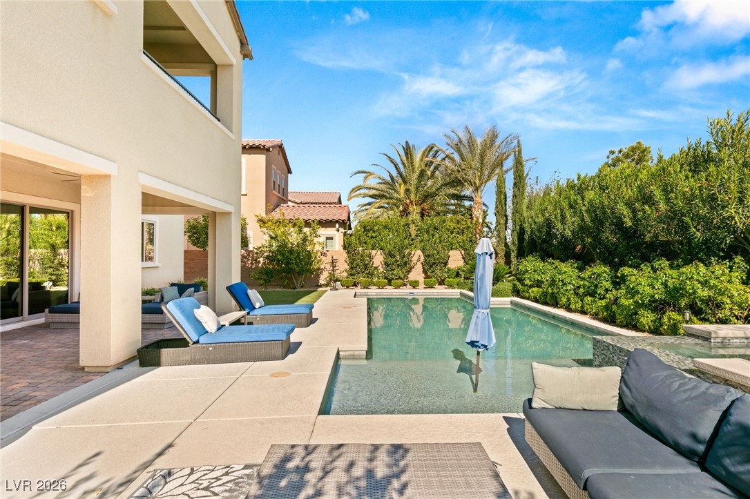 4039 Villa Rafael Drive Las Vegas, NV 89141 - Photo 40 of 45 Outdoor pool with outdoor lounge area and a patio area