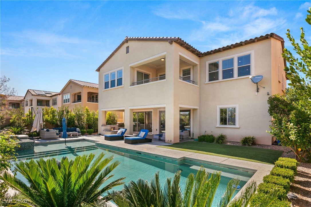 4039 Villa Rafael Drive Las Vegas, NV 89141 - Photo 41 of 45 Back of house with a balcony, a patio, an outdoor hangout area, and an outdoor pool