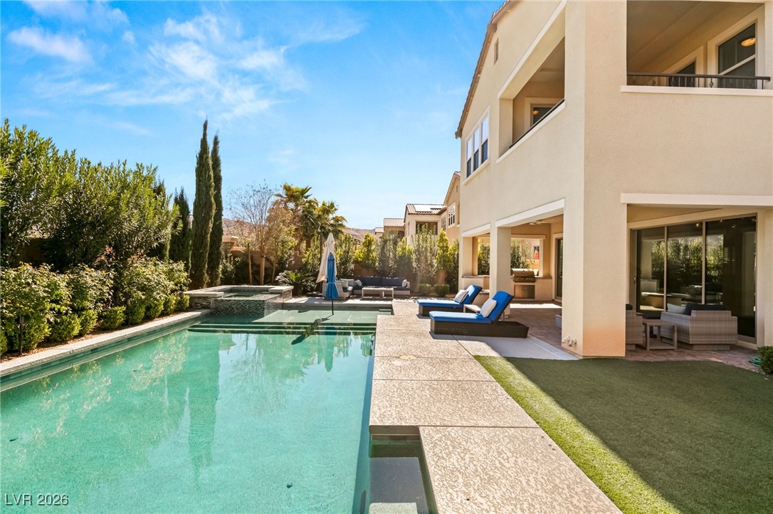 4039 Villa Rafael Drive Las Vegas, NV 89141 - Photo 42 of 45 View of pool with a patio, a balcony, outdoor lounge area, and a pool with connected hot tub