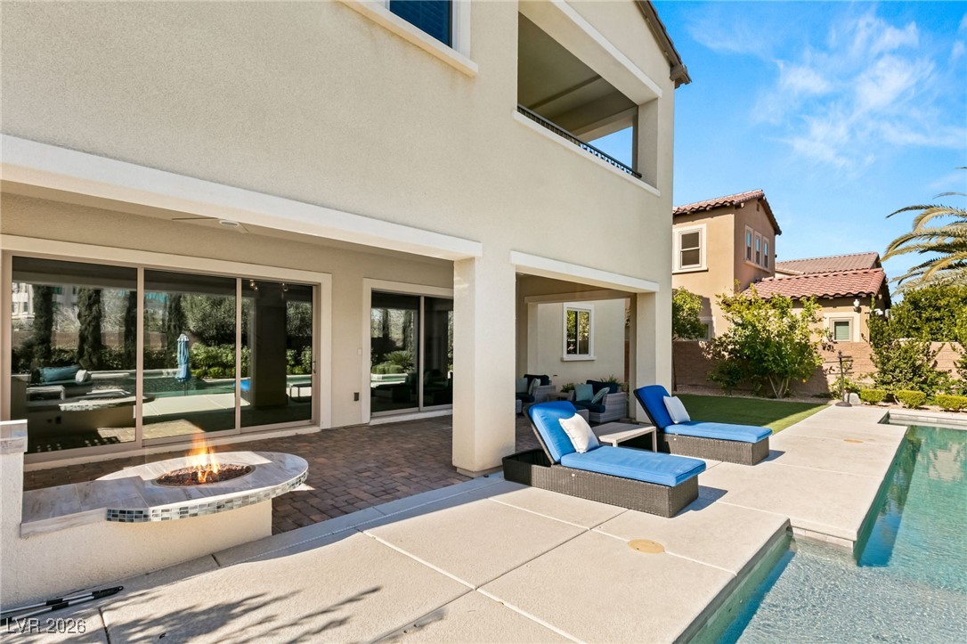 4039 Villa Rafael Drive Las Vegas, NV 89141 - Photo 43 of 45 View of patio featuring an outdoor pool and a fire pit