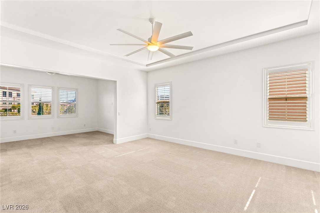4039 Villa Rafael Drive Las Vegas, NV 89141 - Photo 6 of 45 Unfurnished room featuring light carpet and a ceiling fan