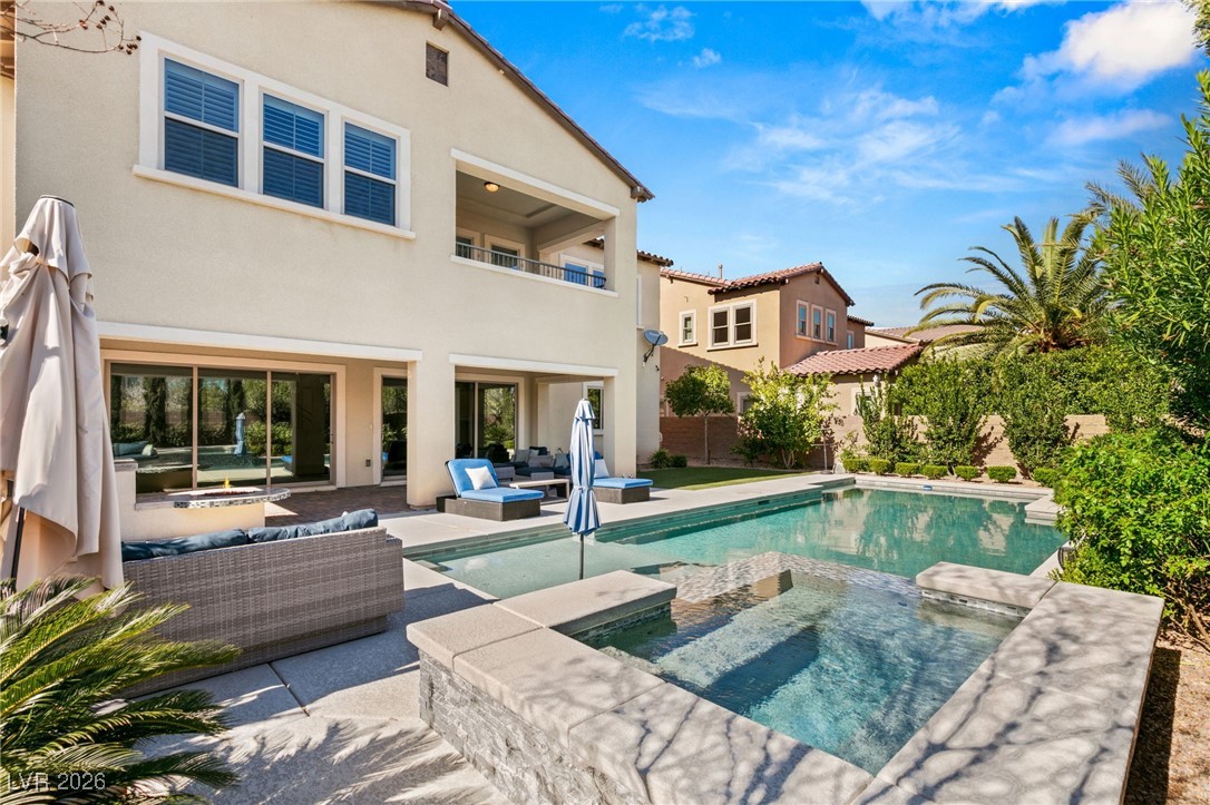 4039 Villa Rafael Drive Las Vegas, NV 89141 - Photo 9 of 45 View of swimming pool featuring a balcony, an outdoor living space, a patio, and a pool with connected hot tub