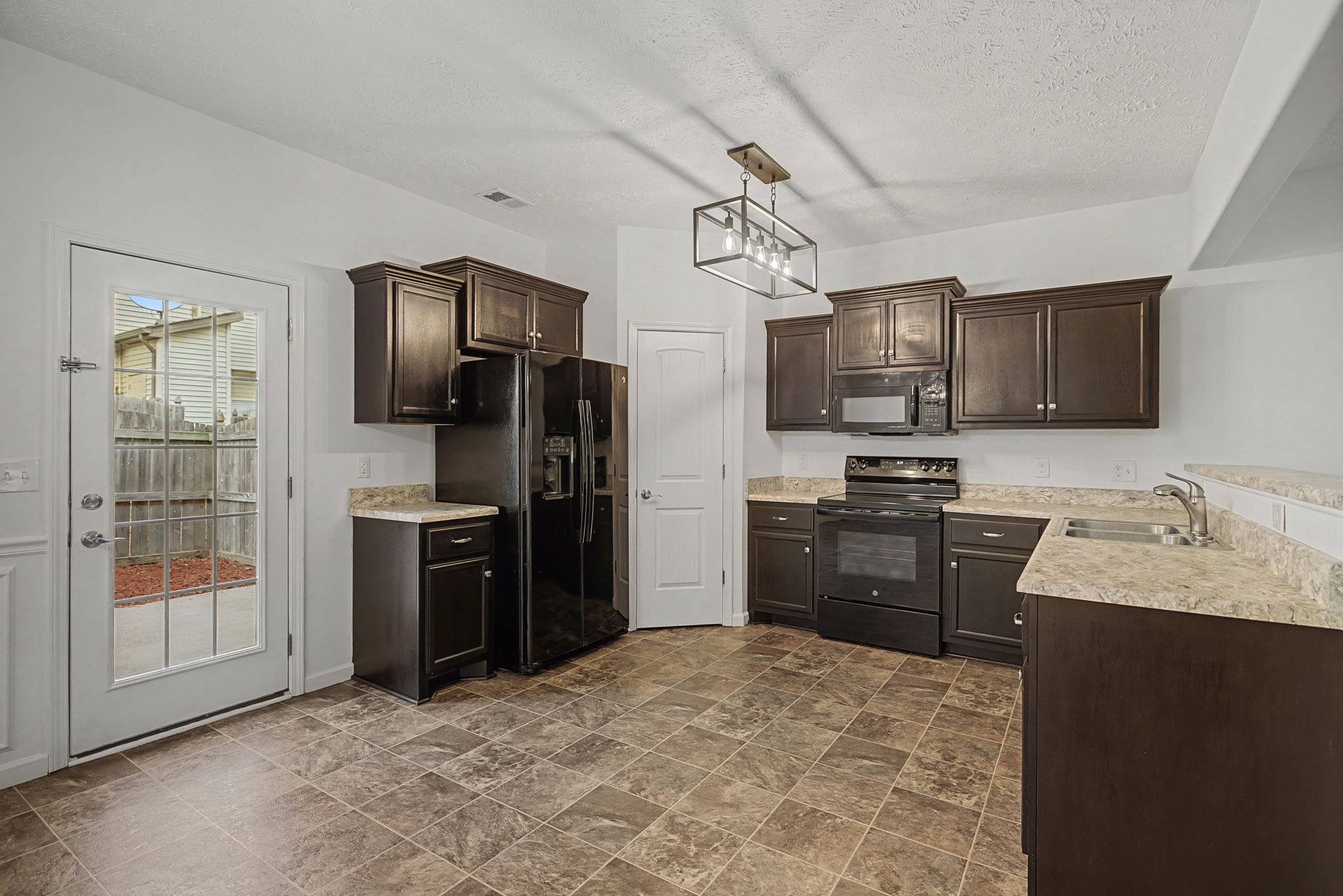 5304 Dan Post Way Murfreesboro, TN 37128 - Photo 11 of 32 a kitchen with stainless steel appliances granite countertop a refrigerator stove top oven a sink and dishwasher