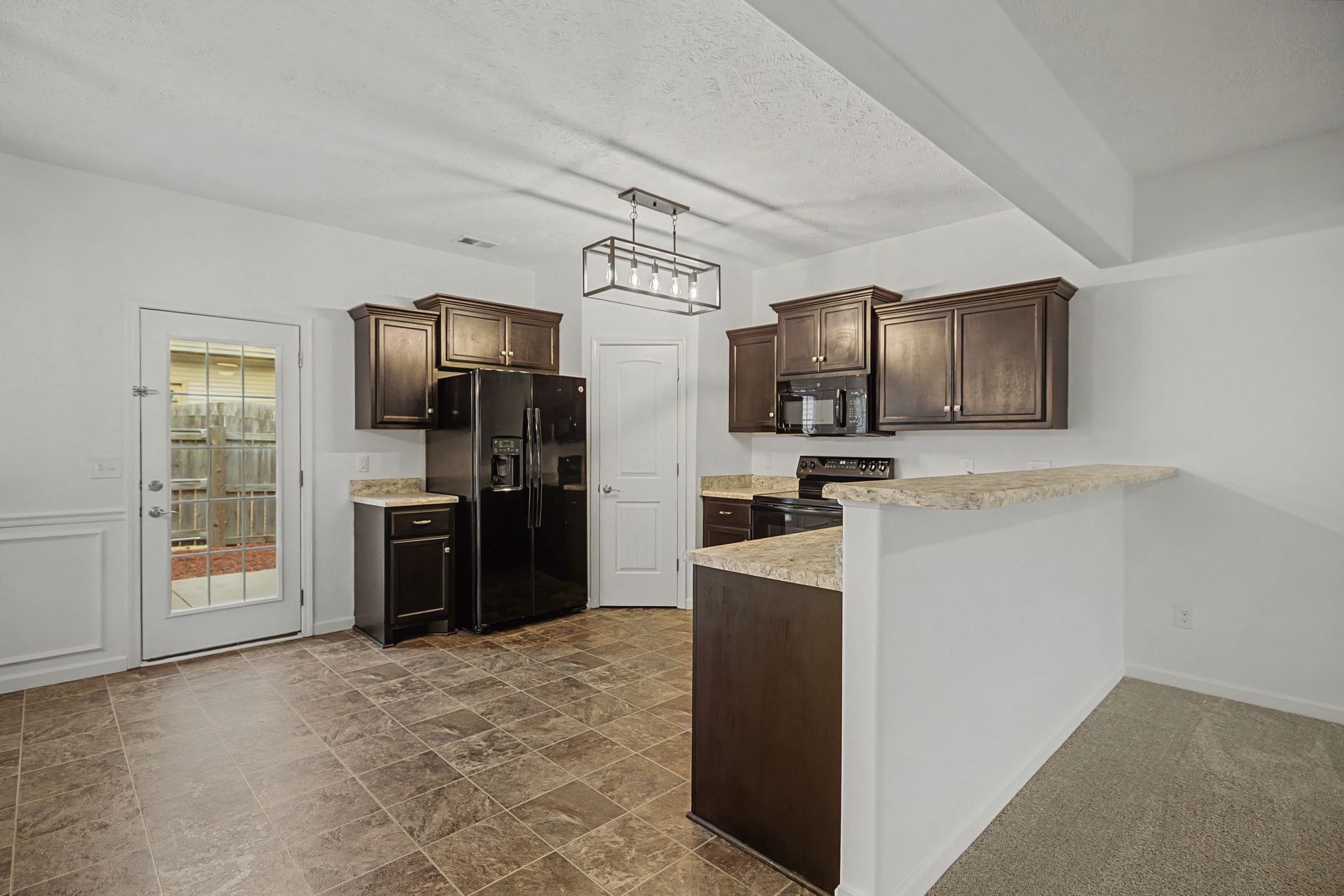 5304 Dan Post Way Murfreesboro, TN 37128 - Photo 13 of 32 a kitchen with stainless steel appliances a refrigerator stove microwave and sink