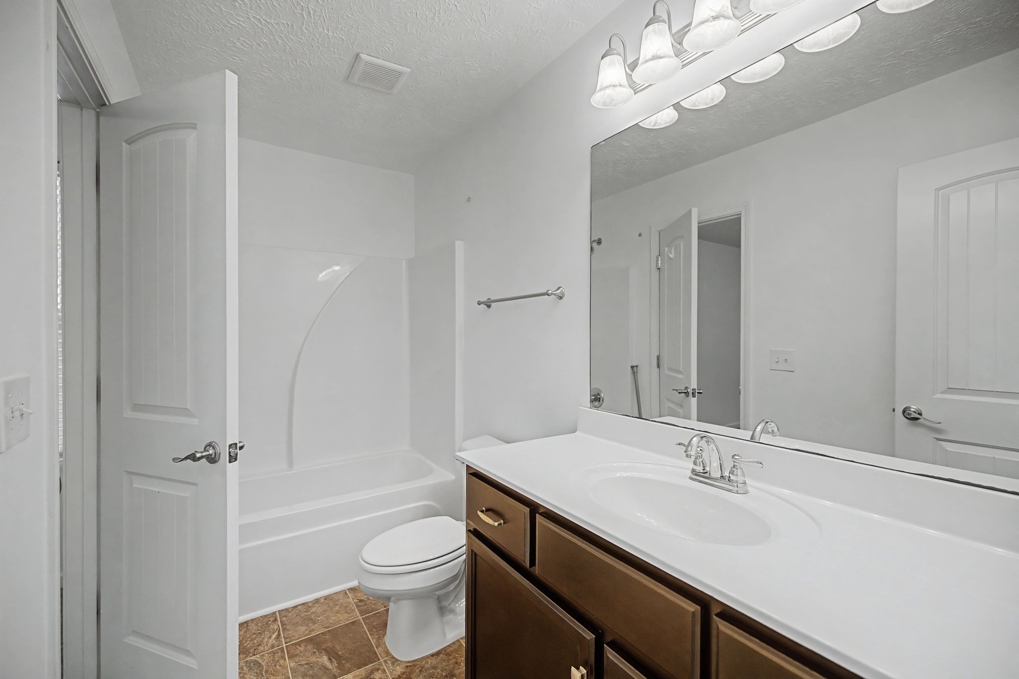 5304 Dan Post Way Murfreesboro, TN 37128 - Photo 20 of 32 a bathroom with a sink a toilet a mirror and shower