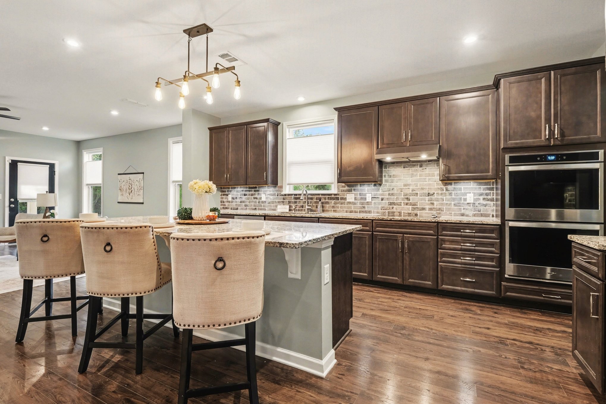 3738 Magpie Lane Murfreesboro, TN 37128 - Photo 11 of 42 a kitchen with a sink cabinets and wooden floor