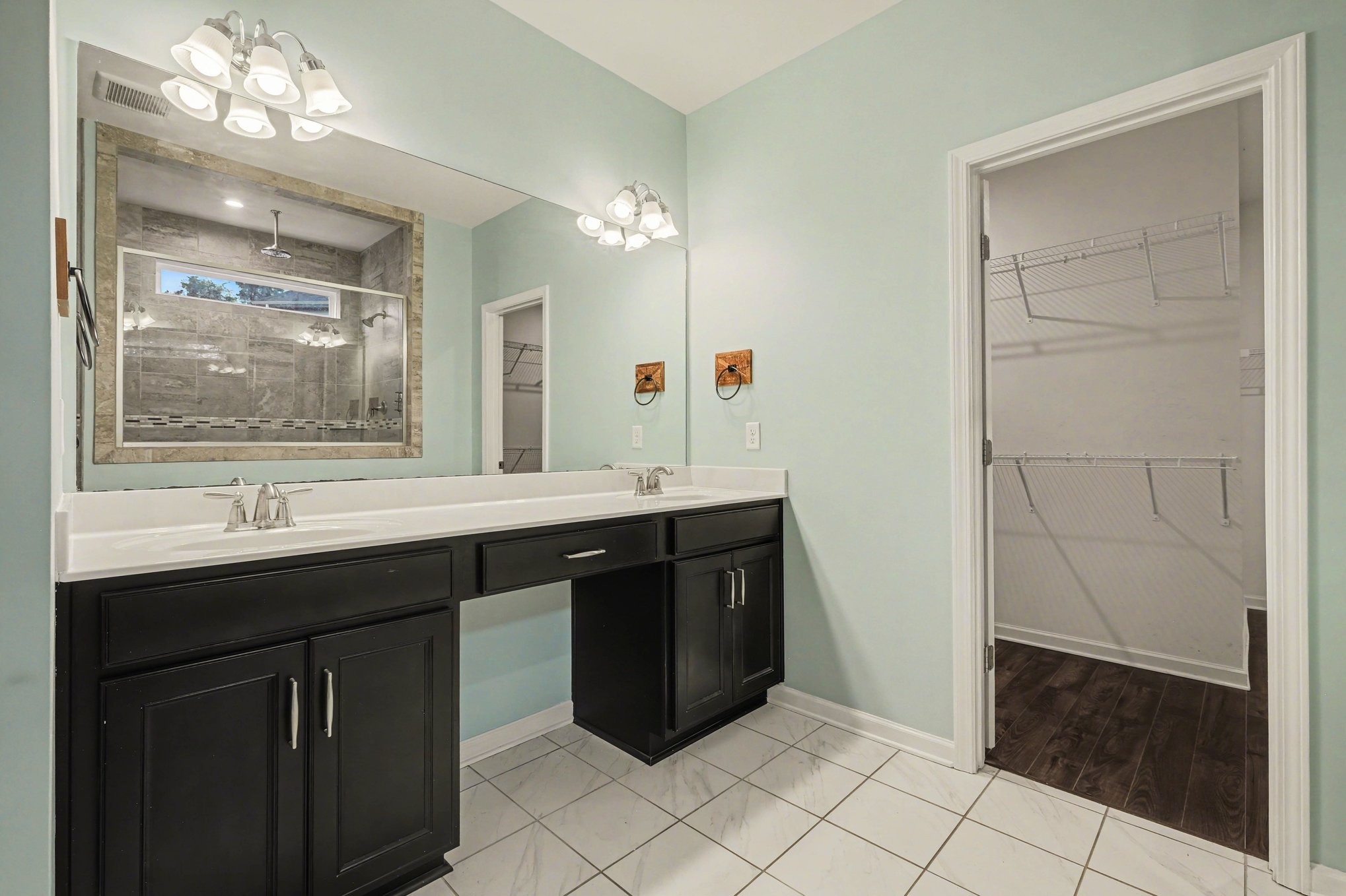 3738 Magpie Lane Murfreesboro, TN 37128 - Photo 19 of 42 a bathroom with a double vanity sink a mirror and a