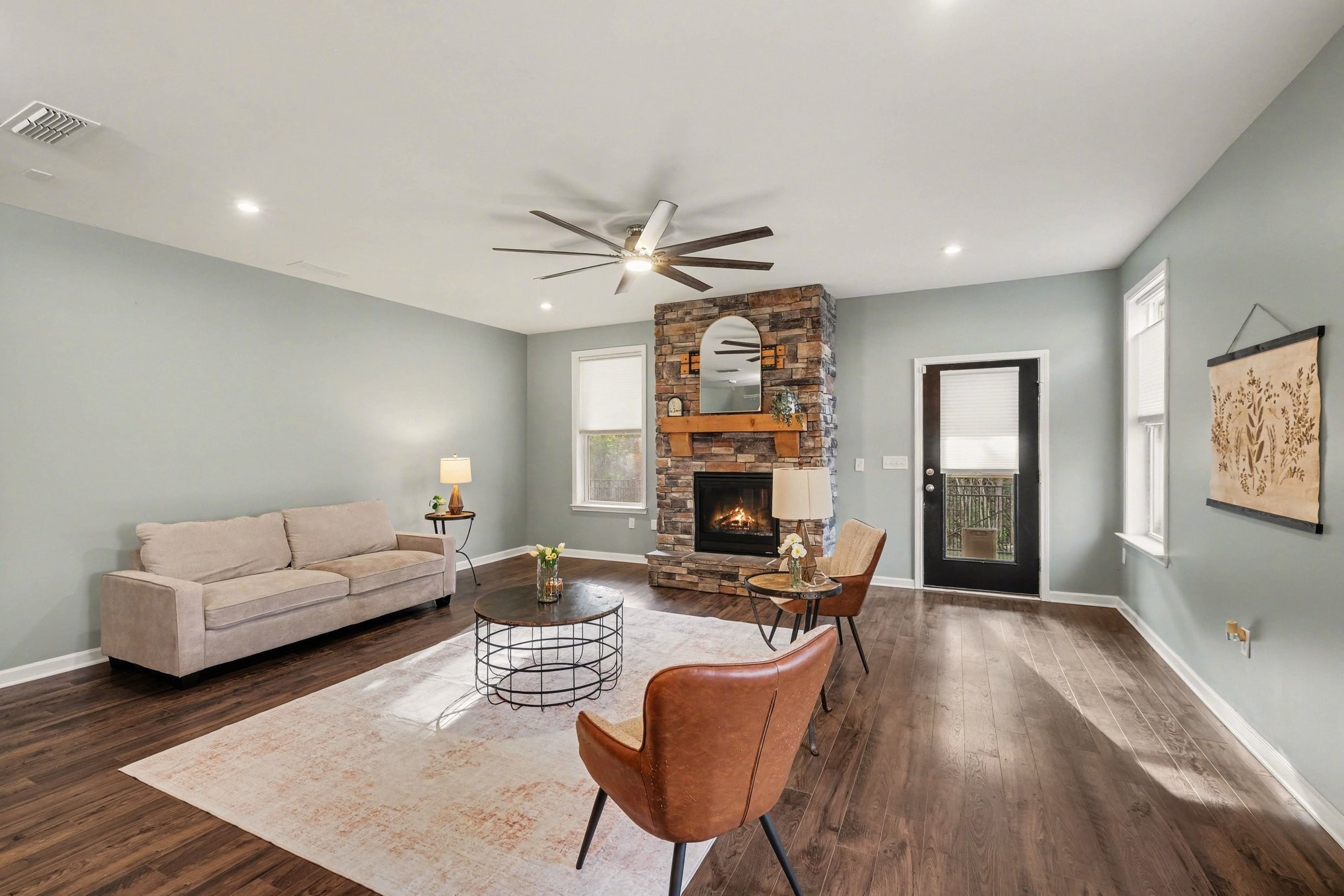 3738 Magpie Lane Murfreesboro, TN 37128 - Photo 5 of 42 a living room with furniture a fireplace and a flat screen tv