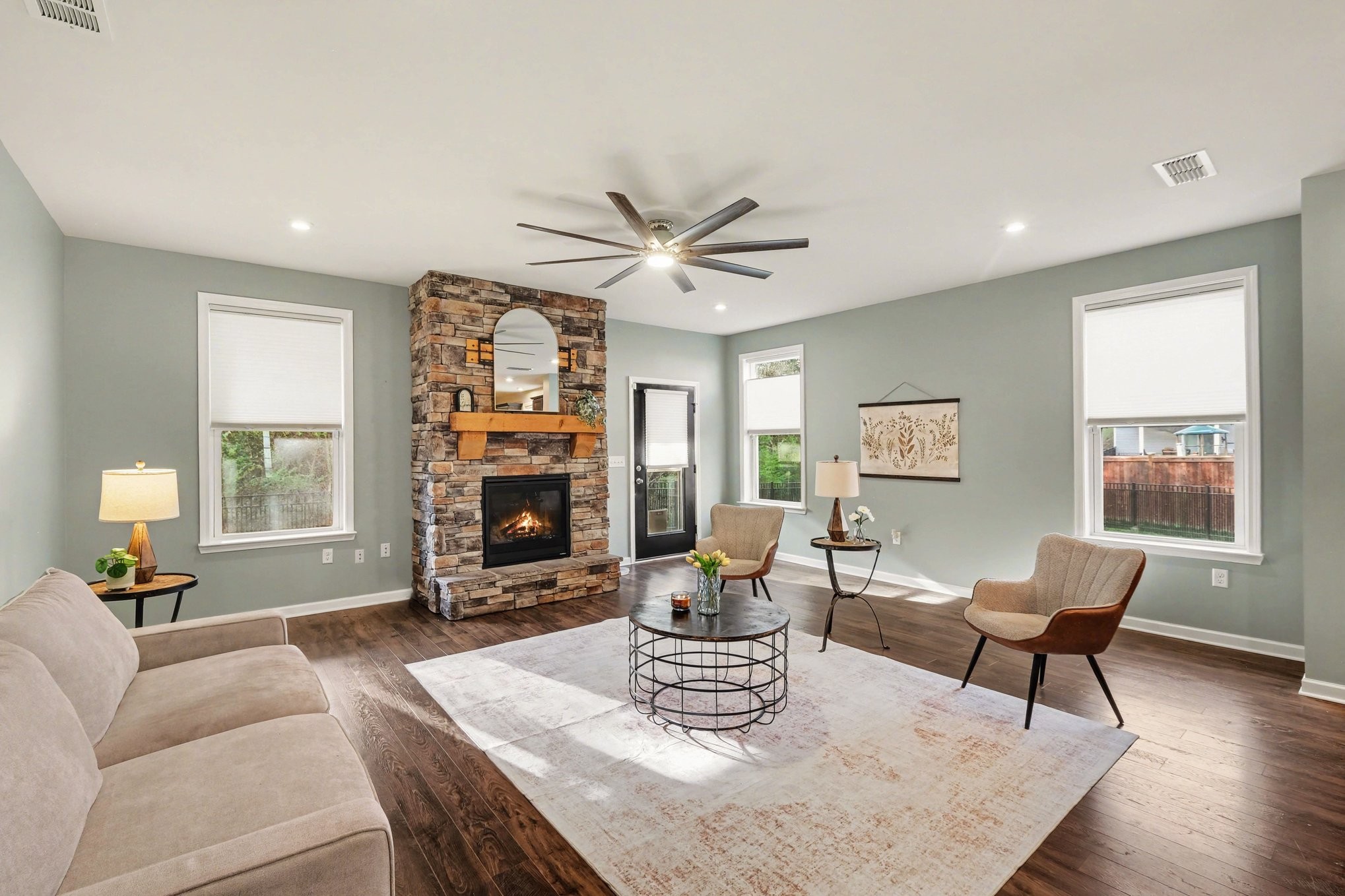 3738 Magpie Lane Murfreesboro, TN 37128 - Photo 8 of 42 a living room with furniture a fireplace and a large window