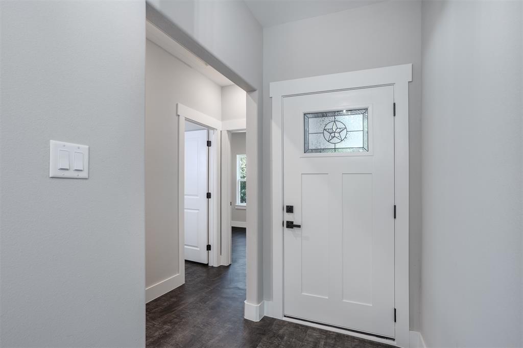 326 West Day Street Denison, TX 75020 - Photo 11 of 27 a view of a hallway with wooden floor